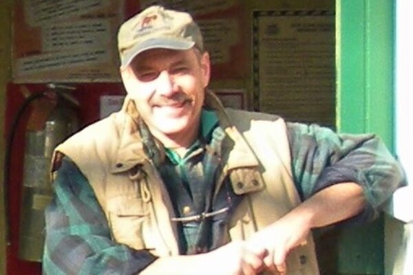 A Man in a Khaki Color Camping Vest